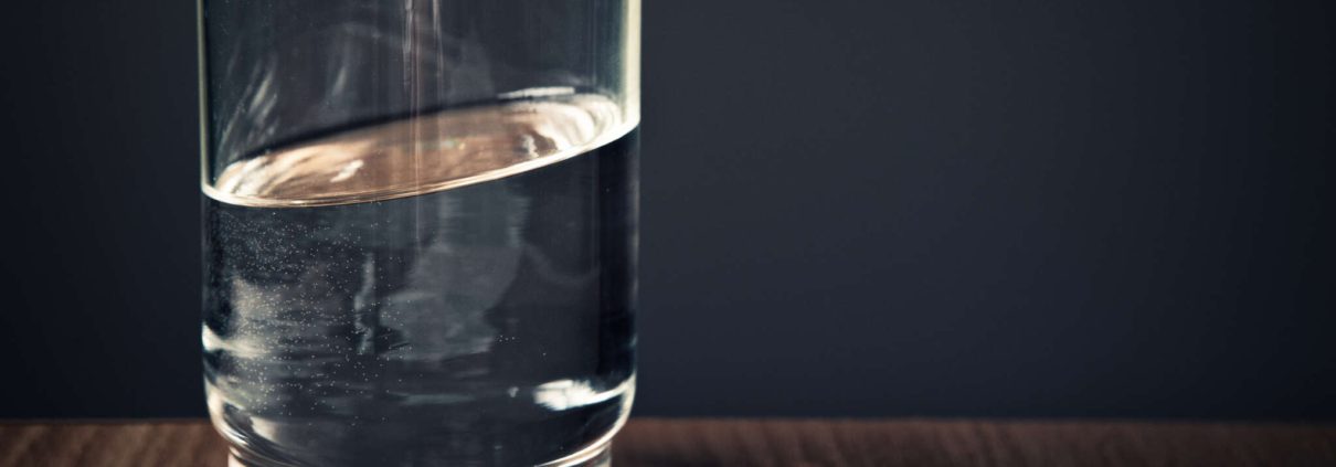 Clear glass of water symbolizing clean and professionally collected samples