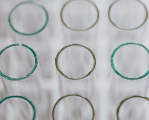 Clean glass test tubes representing lab procedures for private well water testing