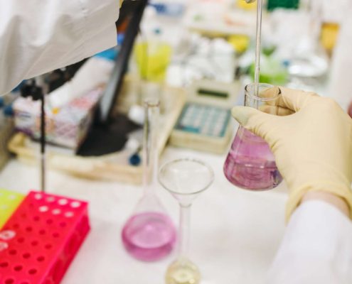 Certified lab technician analyzing water samples related to private well testing